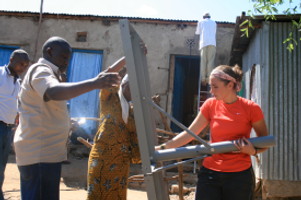 erecting a satellite dish in rural Kenya