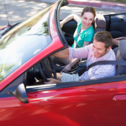 happy couple in convertible car