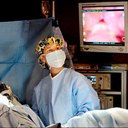 surgeon with Da Vince robotic system