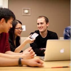 Harvard seniors, from left, Winston Yan, Joy Ding, and Alex Bick discuss plans for their Rover iPhone app.