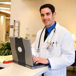 physician with laptop