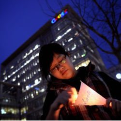 Chinese girl in front of Google's China headquarters