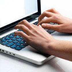 typing on laptop