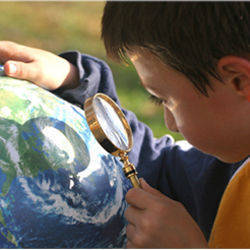 child with magnifying glass