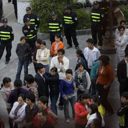 police and factory workers in Dongguan, China