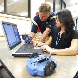 Georgia Tech Associate Professor Tucker Balch and student