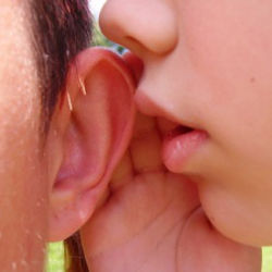 whispering in ear