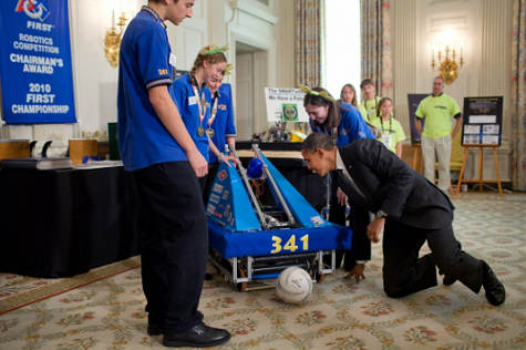 President Obama examines robot