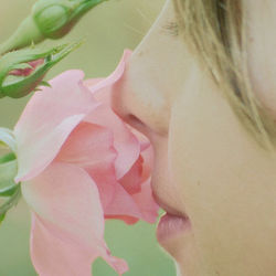 girl sniffing flower