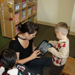 teacher, children with autism, and iPad