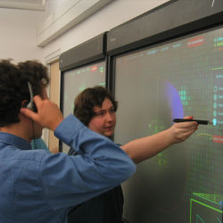 Stanford students at a wall display