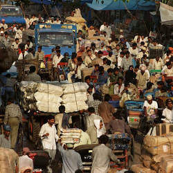 Indians commute on a road to New Dehli