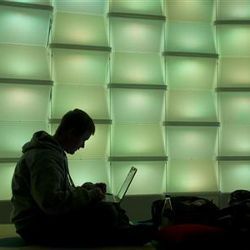 woman using computer in lounge area