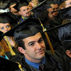 college graduates in caps and gowns