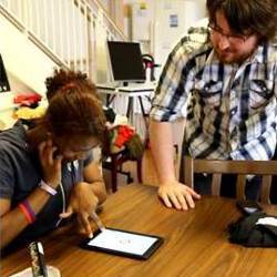 Drexel's Nate Vechiarelli with visually impaired student