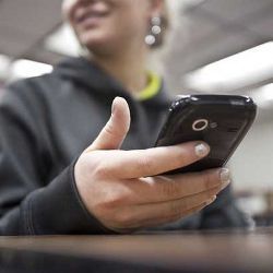 student with smartphone