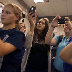 students photograph a crash test