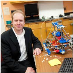 Michigan Tech's Joshua Pearce with an open-source 3-D printer