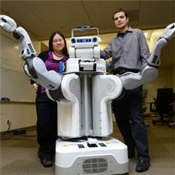 Researchers and robot PR2
