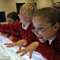 students using multi-touch desk