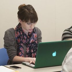 student at laptop computer