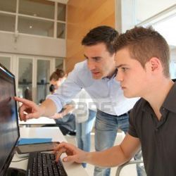 teacher and student at computer