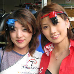 Two ladies wearing augmented reality headsets.