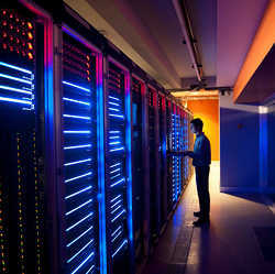 Tending supercomputer servers.