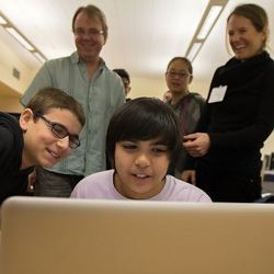 Students testing out the new "SimCity" computer game.