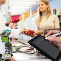 Paying for groceries by using a bank card at checkout.