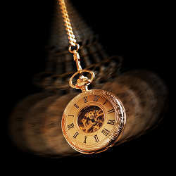 A swinging watch acting as a pendulum.