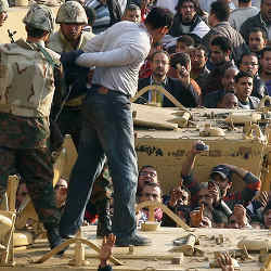 Soldiers arresting a man during the Arab Spring