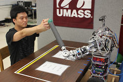 A robot provides physical therapy for a stroke victim.