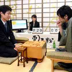 Two men at a shogi board.