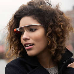 A woman wearing Google Glass.