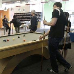 Google employees shooting pool