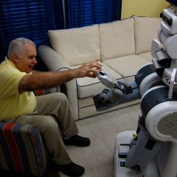 patient accepting medication from a robotic assistant