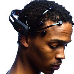 A man wearing a neuro-signal acquisition and processing wireless neuroheadset.