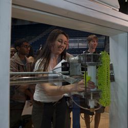 Students demonstrating a window-washing device.