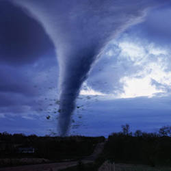 The funnel clouds of a tornado.