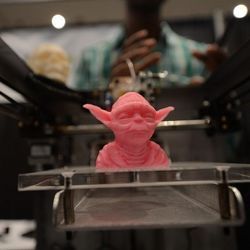 A model of Yoda being produced by a 3D printer. 