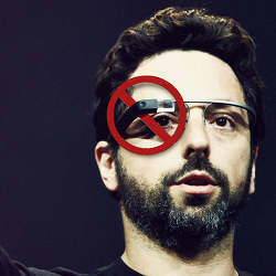 Google's Sergei Brin wears Google Glass, with a "no" sign across the product. 