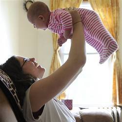 A chemistry doctoral student at Yale plays with her baby daughter at home. 