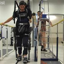 A test subject tries out the mind-controlled Mindwalker exoskeleton.