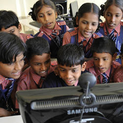 schoolchildren at computer in Hyderabad, India