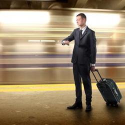 A man waits for a train.