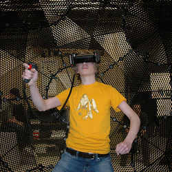 A young man tests out the VirtuSphere VR peripheral.