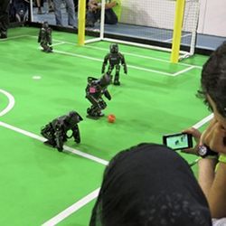 Robots playing soccer.