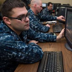 U.S. Navy personnel at computer displays