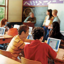 Public school students using laptops in the classroom. 